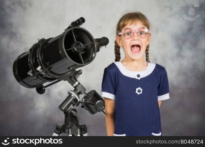 Girl astronomer happily surprised by what he saw in the telescope