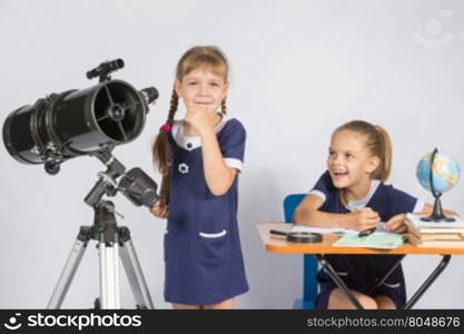 Girl astronomer thought, another girl with a smile looking at her