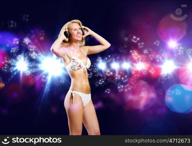 Girl at party. Attractive girl in headphones having fun at disco party