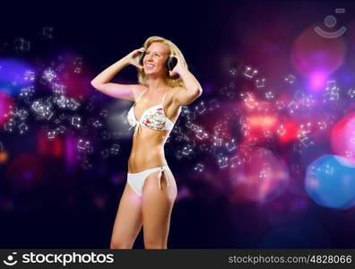 Girl at party. Attractive girl in headphones having fun at disco party