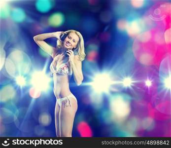 Girl at party. Attractive girl in headphones having fun at disco party