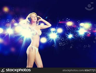 Girl at party. Attractive girl in headphones having fun at disco party