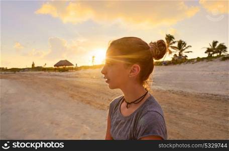 Girl at sunset caribbean beach in Mexico Riviera Maya