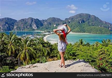 Girl at the resort in a dress on the background of the bays of the island of Phi Phi Don