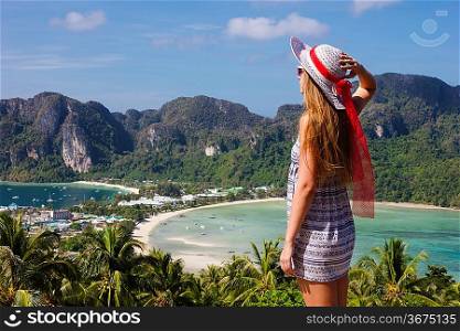 Girl at the resort in a dress on the background of the bays of the island of Phi Phi Don