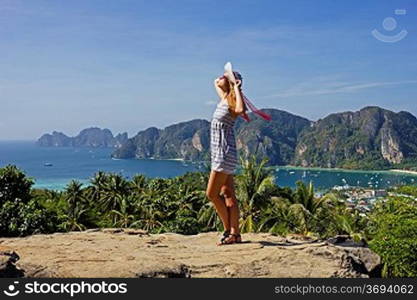 Girl at the resort in a dress on the background of the bays of the island of Phi Phi Don