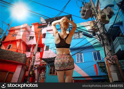 girl athlete. Colorful painted buildings of Favela in Rio de Janeiro Brazil