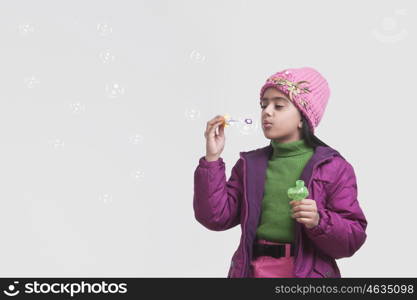 Girl blowing bubbles