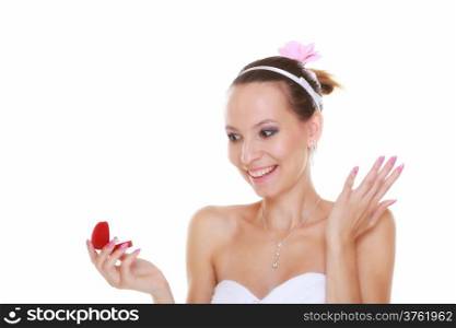 Girl bride in white dress with surprise looks at red box with wedding ring, isolated on white background.