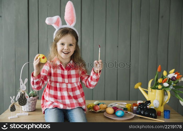 girl bunny ears painting egg easter