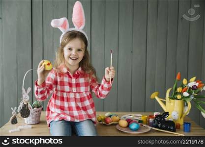 girl bunny ears painting egg easter