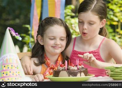 Girl celebrating her birthday with her sister