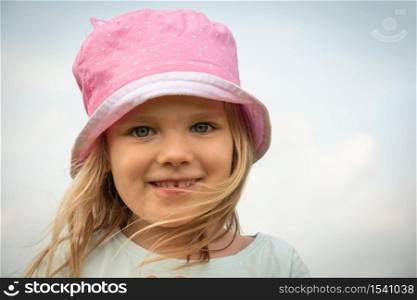 Girl child portrait. Little kid smiling face. Happy adorable and pretty young female head. Joy and happiness expression of caucasian child. close-up of smile preschooler happy child with blond hair.