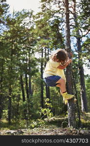 Girl climbing tree