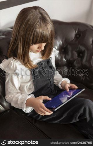 girl couch with tablet