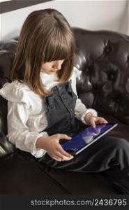 girl couch with tablet