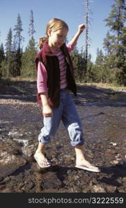 Girl Crossing the River