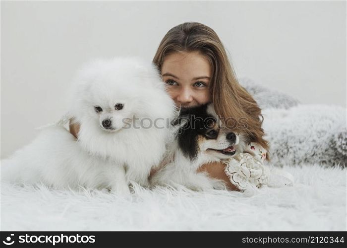girl cute white pups sitting bed