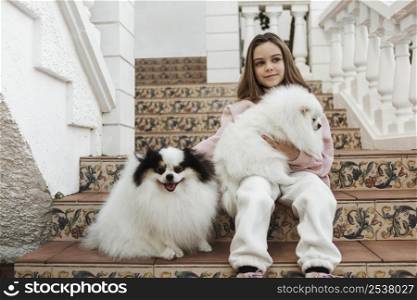 girl cute white pups sitting stairs