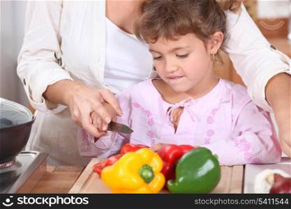 Girl cutting Peppers
