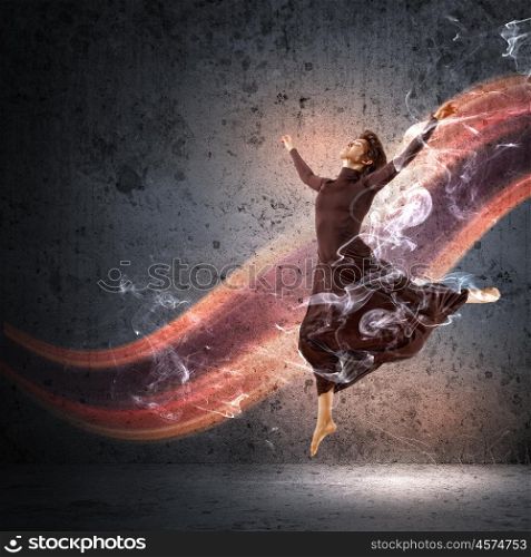 Girl dancing in a color dress with a gray background. Collage