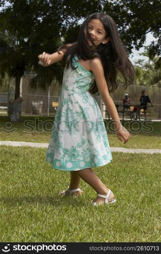 Girl dancing in a park