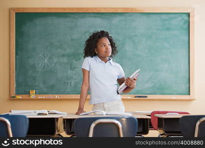 Girl daydreaming in classroom