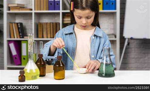 girl doing science experiments