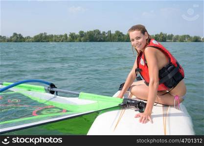 girl doing windsurfing