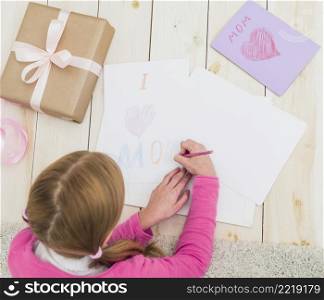 girl drawing i love mom paper sheet
