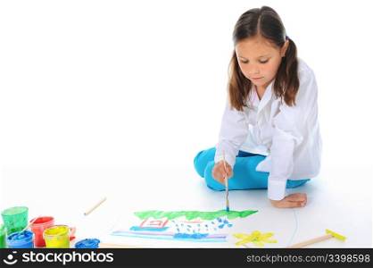Girl draws on the album. Isolated on white background