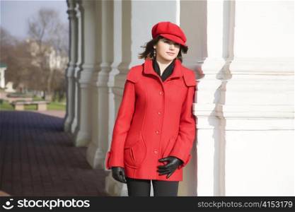 Girl Dressed In Red Coat And Cap