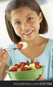 Girl Eating A Bowl Of Fresh Fruit Salad