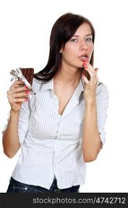 Girl eating a chocolate candy