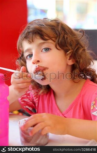 Girl eating chocolate ice cream dirty face having fun
