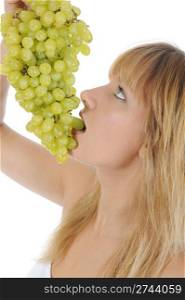 Girl eating grapes. Isolated on white background