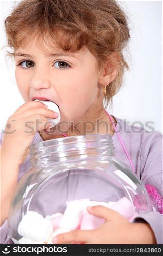 Girl eating marshmallows