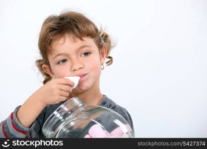 Girl eating marshmallows