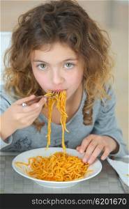 Girl eating noodles