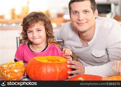 Girl emptying pumpkin