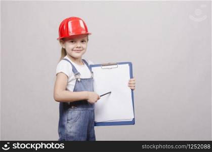 Girl engineer is a helmet folder and pencil