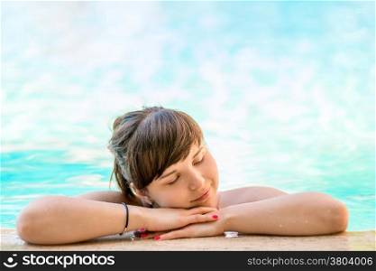 girl enjoys the pool in the hotel