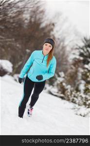Girl exercising in park, front view. Winter sports, outdoor fitness, fashion, nature workout, health concept.. Winter sport, girl exercising in park