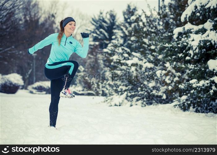 Girl exercising in park. Winter sports, outdoor fitness, fashion, nature workout, health concept.. Winter sport, girl exercising in park