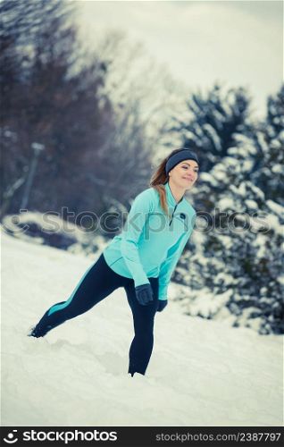 Girl exercising in park. Winter sports, outdoor fitness, fashion, nature workout, health concept.. Winter sport, girl exercising in park