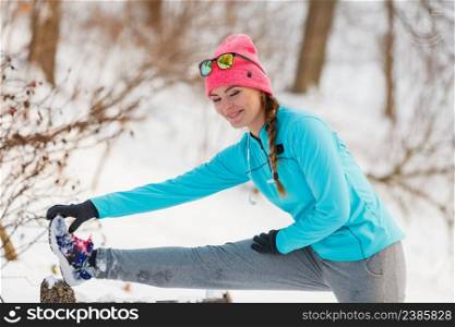 Girl exercising on bench. Winter sports fitness fashion health concept. Girl exercising on bench