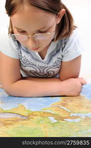 Girl exploring the geographic map of Eurasia