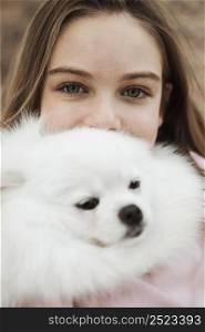 girl fluffy dog close up