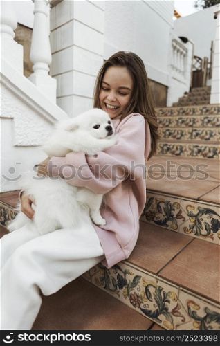 girl fluffy dog stairs
