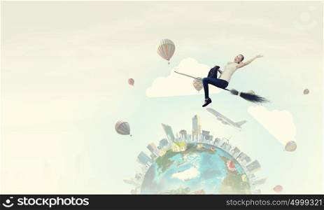 Girl fly on broom. Happy young woman flying in sky on broom. Elements of this image are furnished by NASA